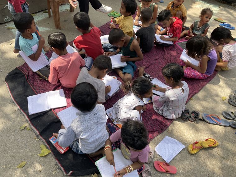 A classroom session on a mat outdoors